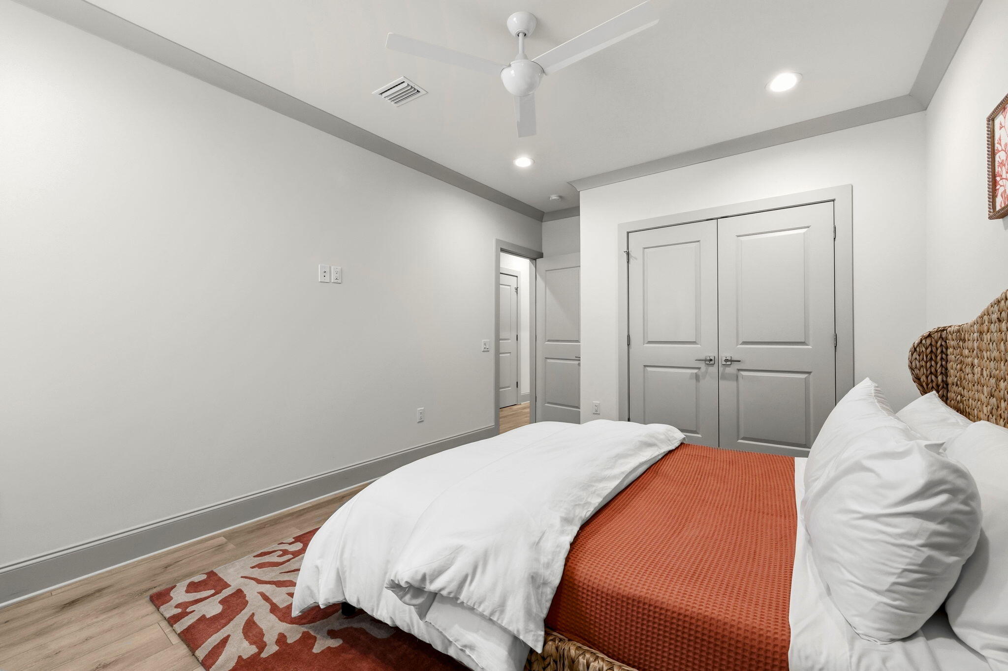 45 Golden Bell Court, Unit 45C Inlet Beach, FL 32461 - Photo 27 of 43 a bedroom with a large bed and a chandelier