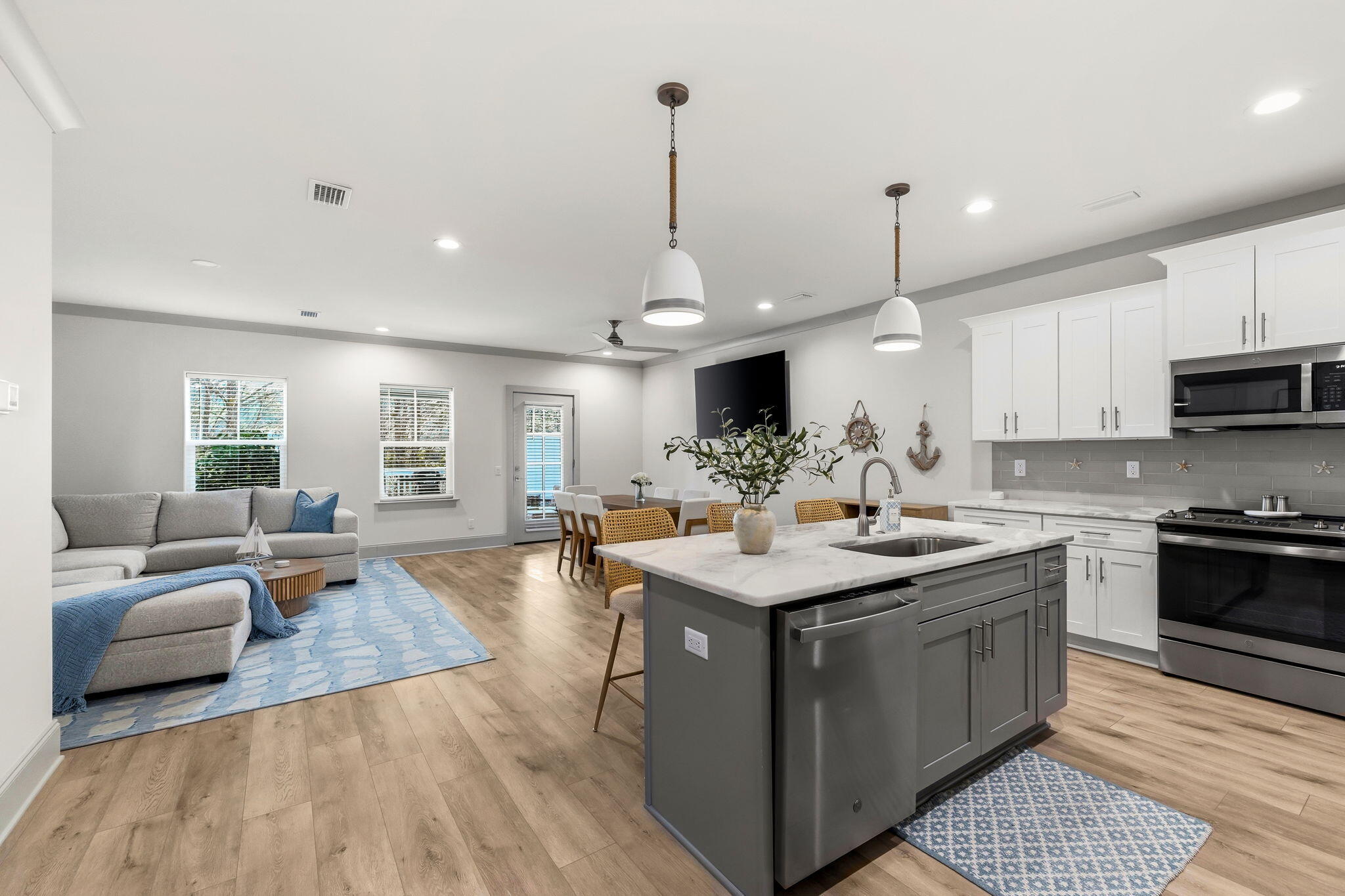 45 Golden Bell Court, Unit 45C Inlet Beach, FL 32461 - Photo 8 of 43 a kitchen with kitchen island granite countertop a sink cabinets and wooden floor