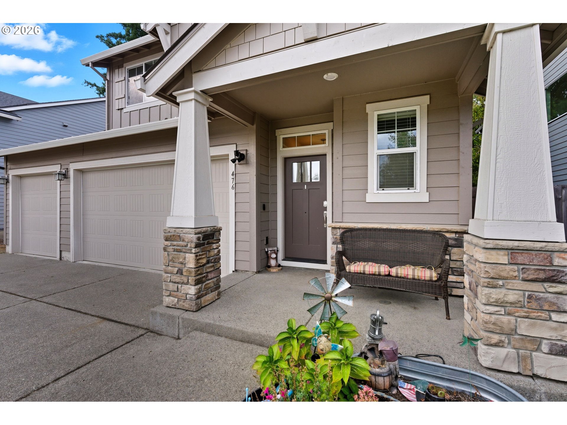 476 Southwest 15th Avenue Canby, OR 97013 - Photo 5 of 41 front view of a house with a bench