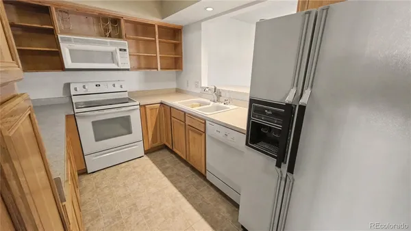 a kitchen with a stove microwave and cabinets
