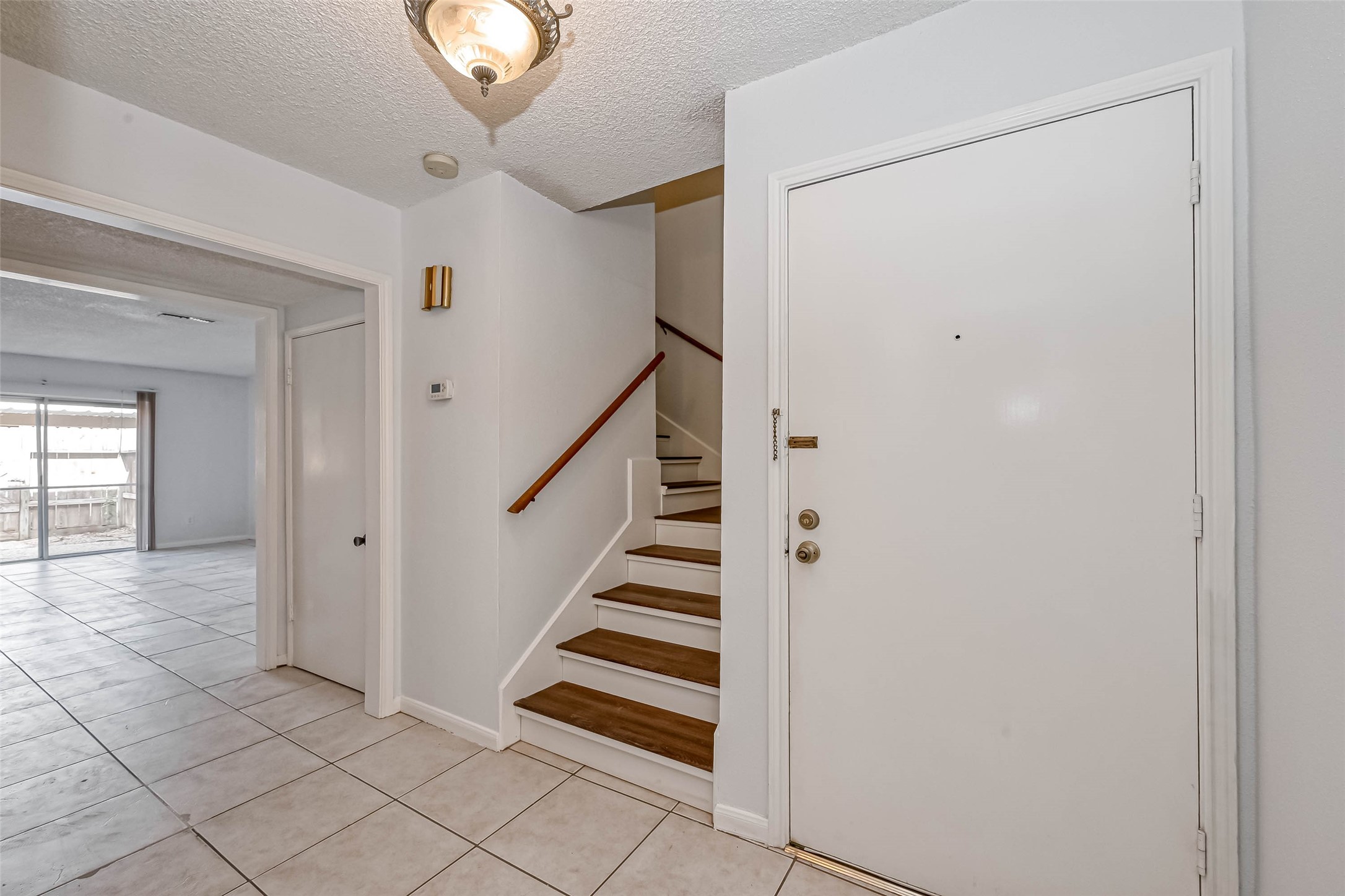 14179 Misty Meadow Lane Houston, TX 77079 - Photo 9 of 41 a view of entryway with stairs and wooden floor