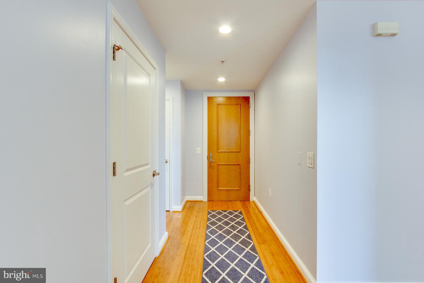 11990 Market Street, Unit 1308 Reston, VA 20190 - Photo 2 of 30 a view of bathroom with bathtub and wooden floor