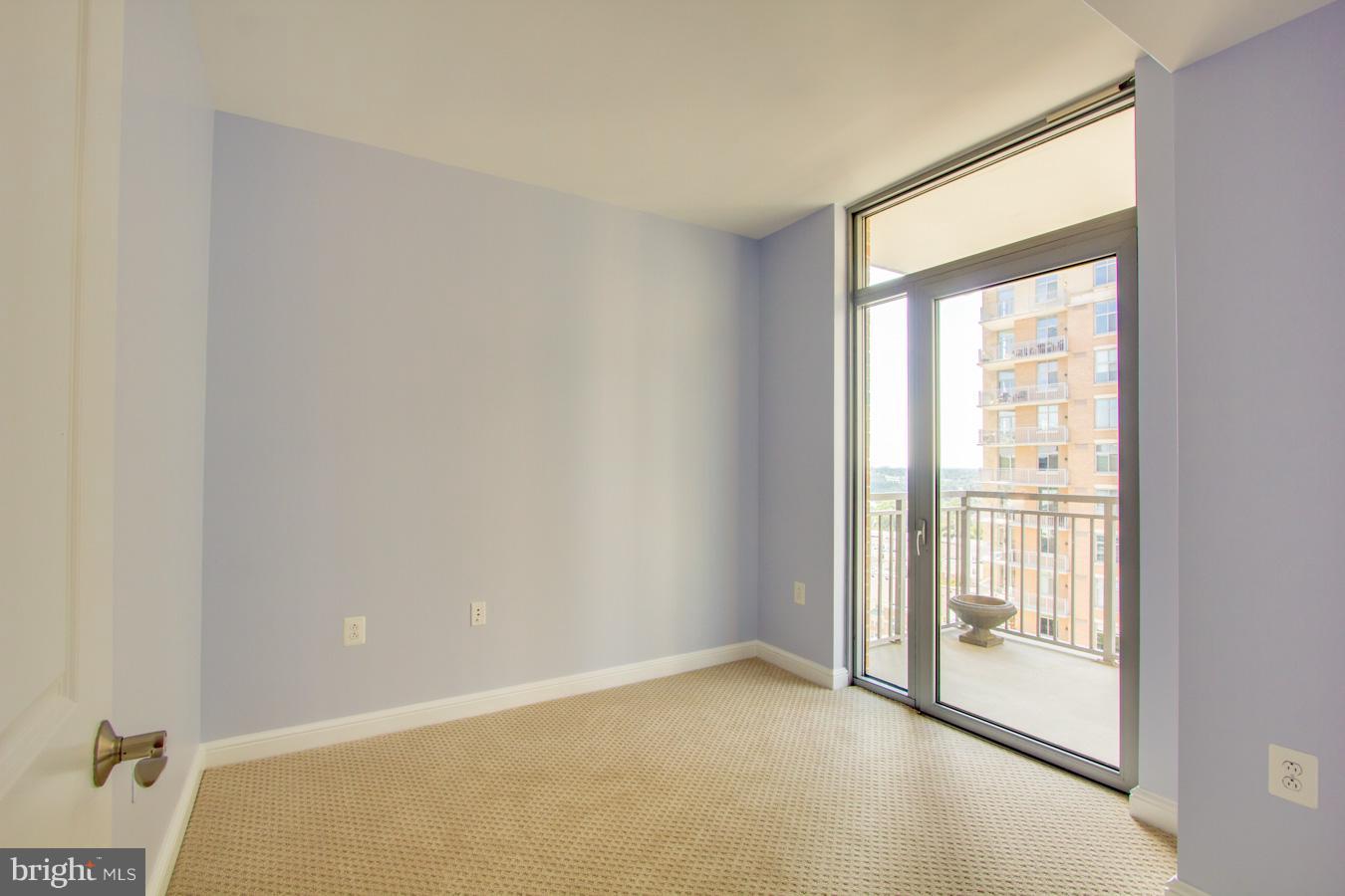 11990 Market Street, Unit 1308 Reston, VA 20190 - Photo 16 of 30 a view of an empty room with a window