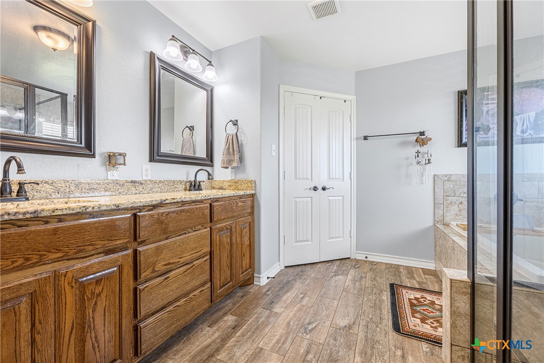 16101 Dove Road Moody, TX 76557 - Photo 20 of 42 a bathroom with a sink and a mirror