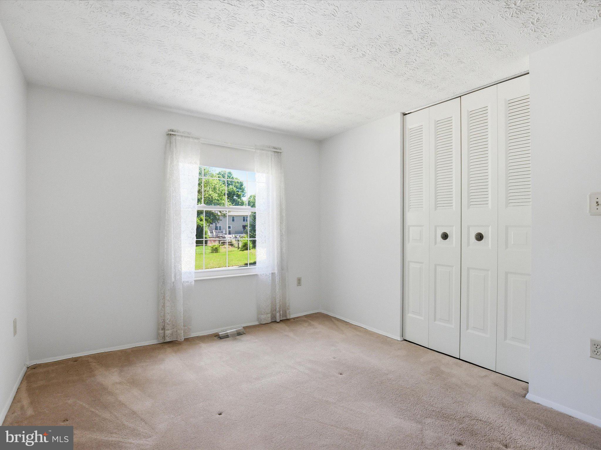 6314 West Vein Road Bowie, MD 20720 - Photo 18 of 28 a view of an empty room with window & cabinet area