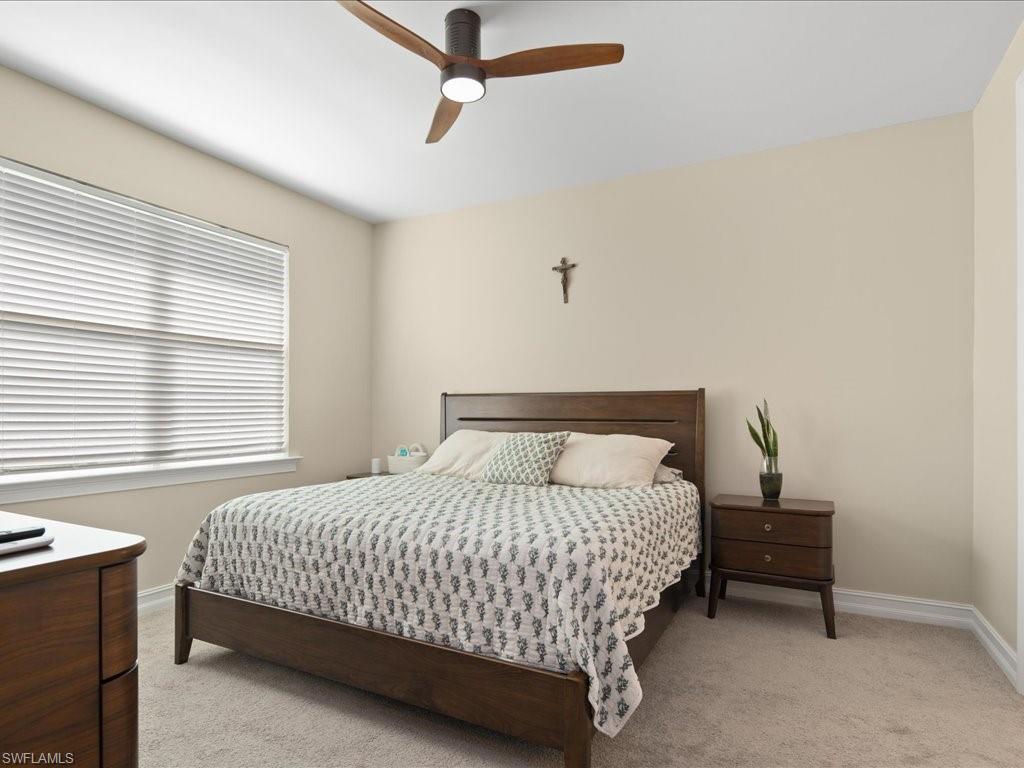 1046 Enbrook Loop Naples, FL 34114 - Photo 16 of 43 Carpeted bedroom featuring ceiling fan