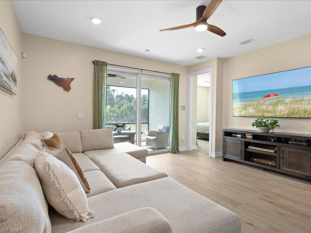 1046 Enbrook Loop Naples, FL 34114 - Photo 20 of 43 Living room featuring ceiling fan and light hardwood / wood-style flooring