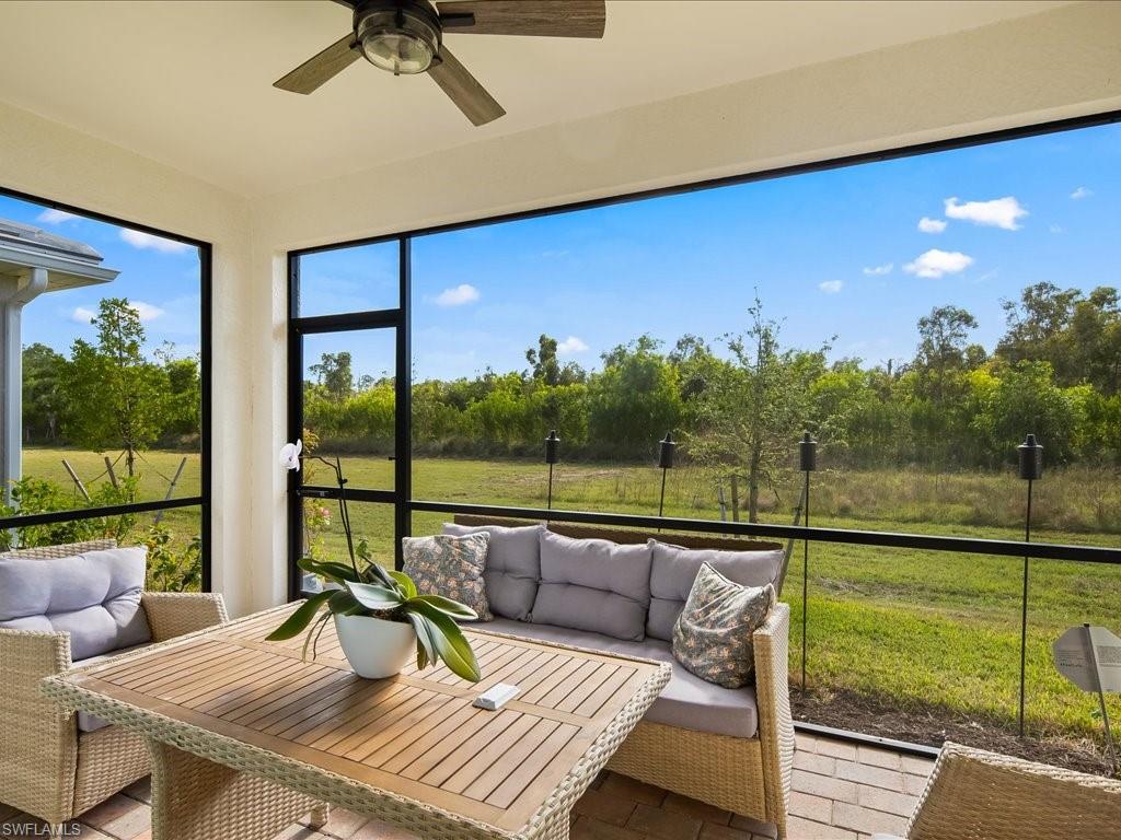 1046 Enbrook Loop Naples, FL 34114 - Photo 23 of 43 Sunroom featuring ceiling fan