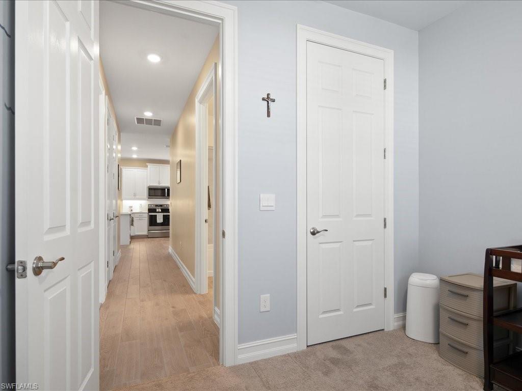 1046 Enbrook Loop Naples, FL 34114 - Photo 9 of 43 Hall featuring light hardwood / wood-style floors