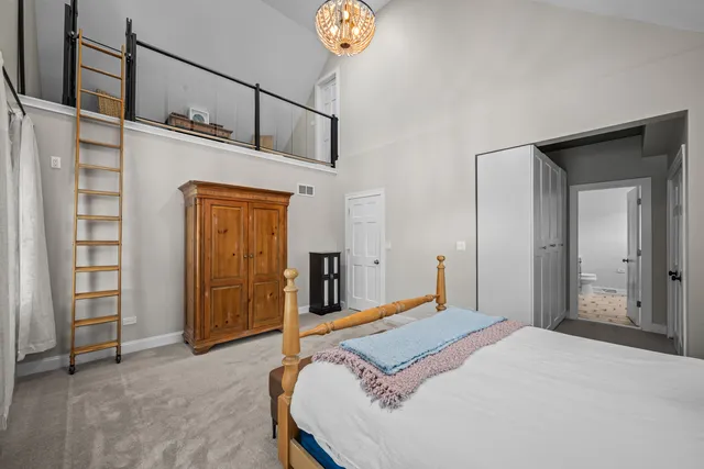 a bedroom with a bed and a cabinets