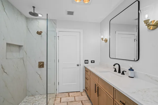 a bathroom with a sink and a mirror