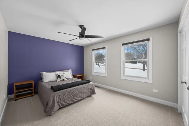 a bedroom with furniture and a window