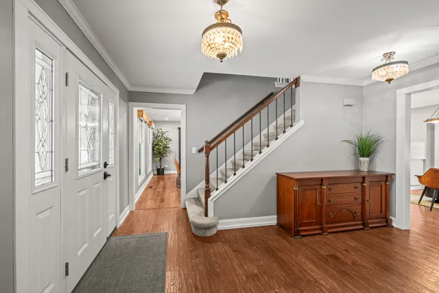a view of entryway with wooden floor