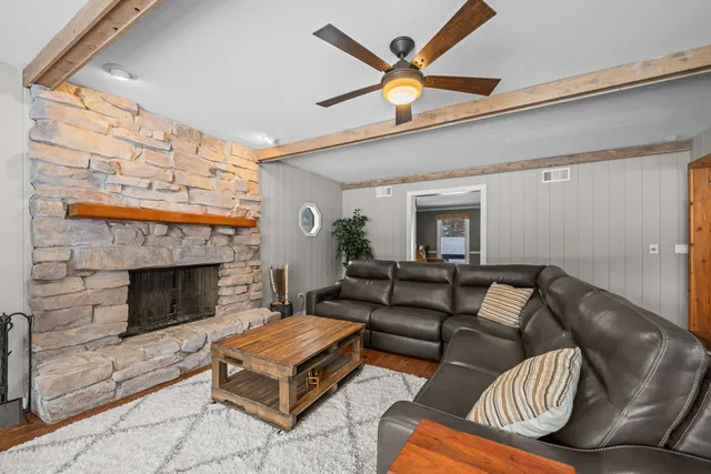 a living room with furniture and a fireplace