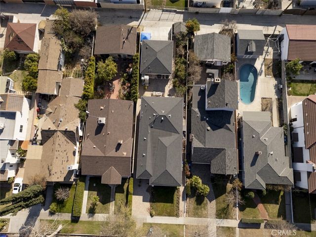 an aerial view of houses with outdoor space