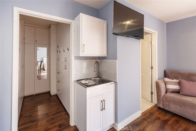 a kitchen with stainless steel appliances a stove and a refrigerator