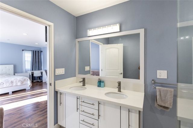 a spacious bathroom with a sink double vanity and a mirror