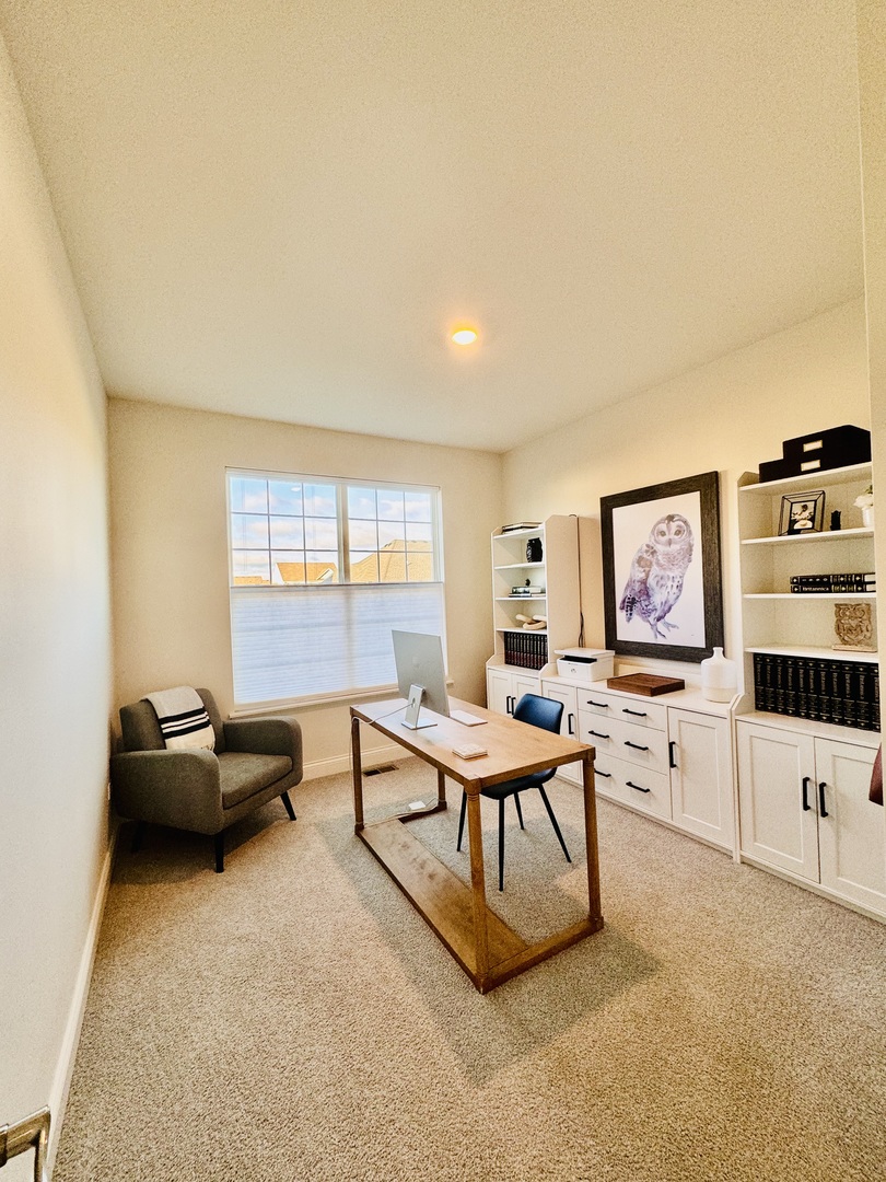 3626 Edelweiss Road Elgin, IL 60124 - Photo 12 of 28 a living room with furniture and white walls
