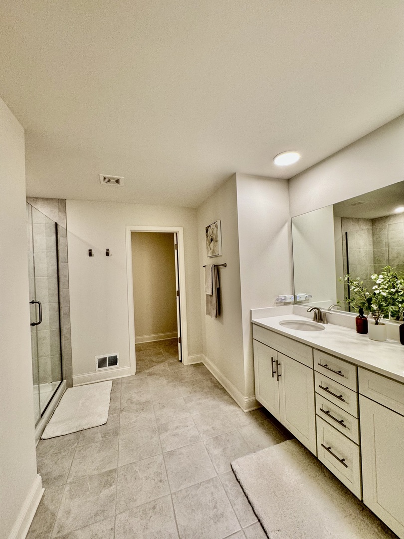 3626 Edelweiss Road Elgin, IL 60124 - Photo 16 of 28 a spacious bathroom with a mirror sink and shower