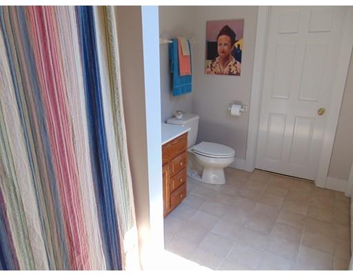 38 Richmond Road Freetown, MA 02702 - Photo 25 of 30 a bathroom with a toilet and a shower curtain