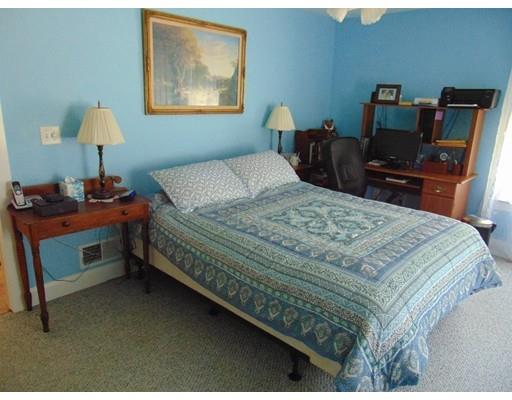 38 Richmond Road Freetown, MA 02702 - Photo 29 of 30 a bedroom with a bed and a lamp on table