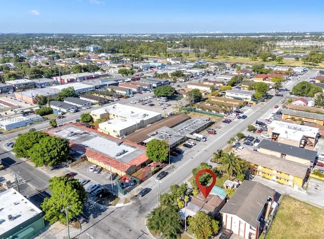 an aerial view of residential houses with outdoor space