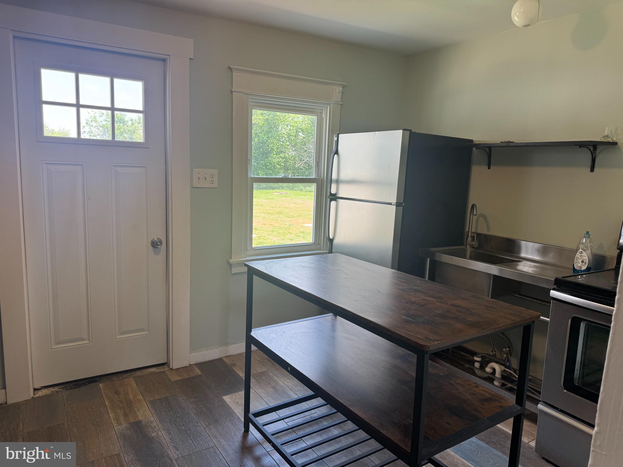 3754 Baltimore Pike, Unit 3 Littlestown, PA 17340 - Photo 8 of 21 a view of a kitchen with a table and chairs