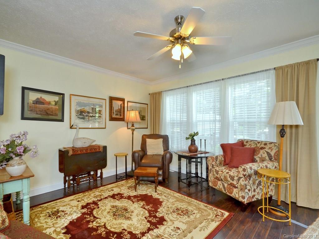 141 Ingram Loop Clyde, NC 28721 - Photo 4 of 16 a living room with furniture and a chandelier