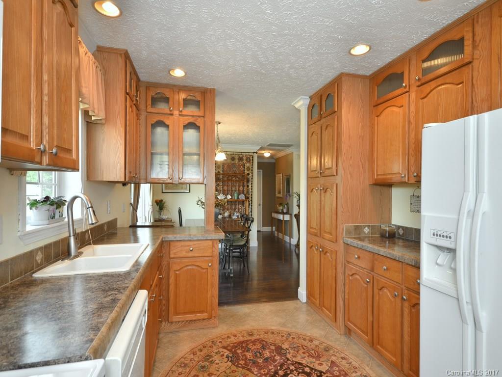 141 Ingram Loop Clyde, NC 28721 - Photo 6 of 16 a kitchen with stainless steel appliances granite countertop a refrigerator and a sink