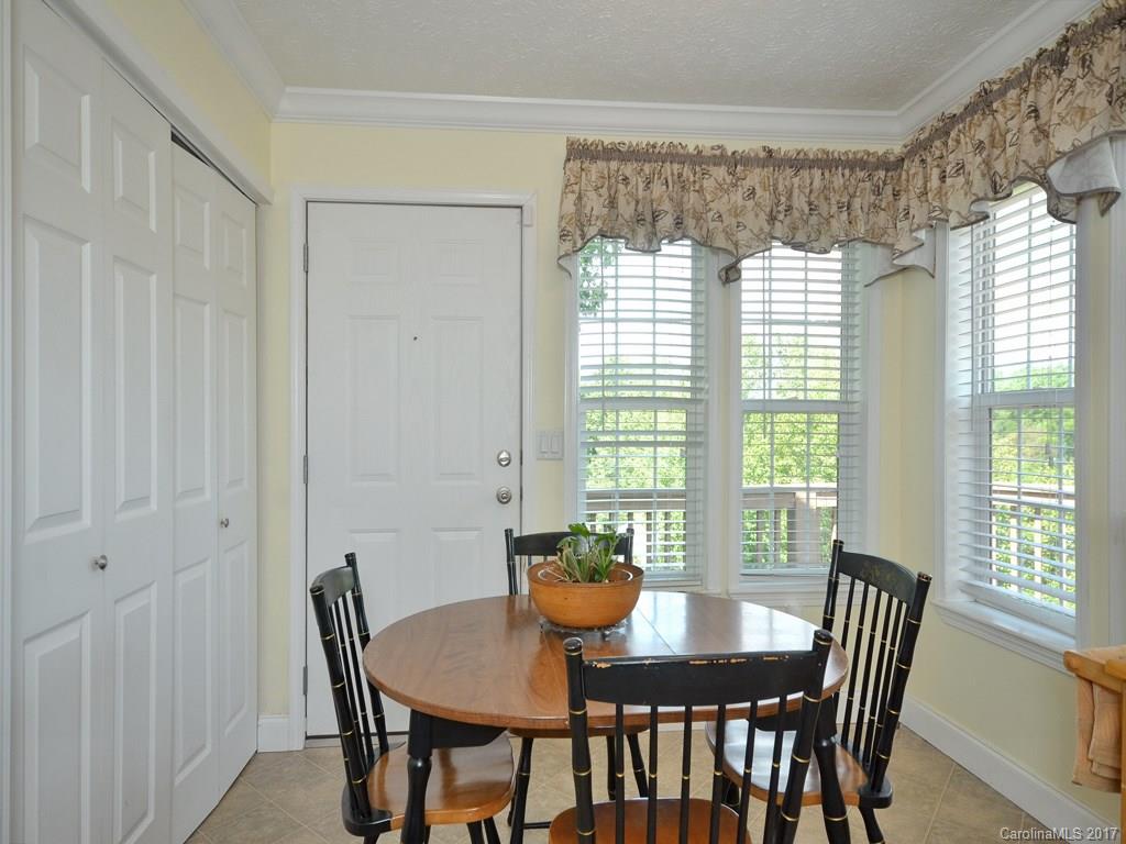 141 Ingram Loop Clyde, NC 28721 - Photo 7 of 16 a view of a dining room with furniture window and outside view