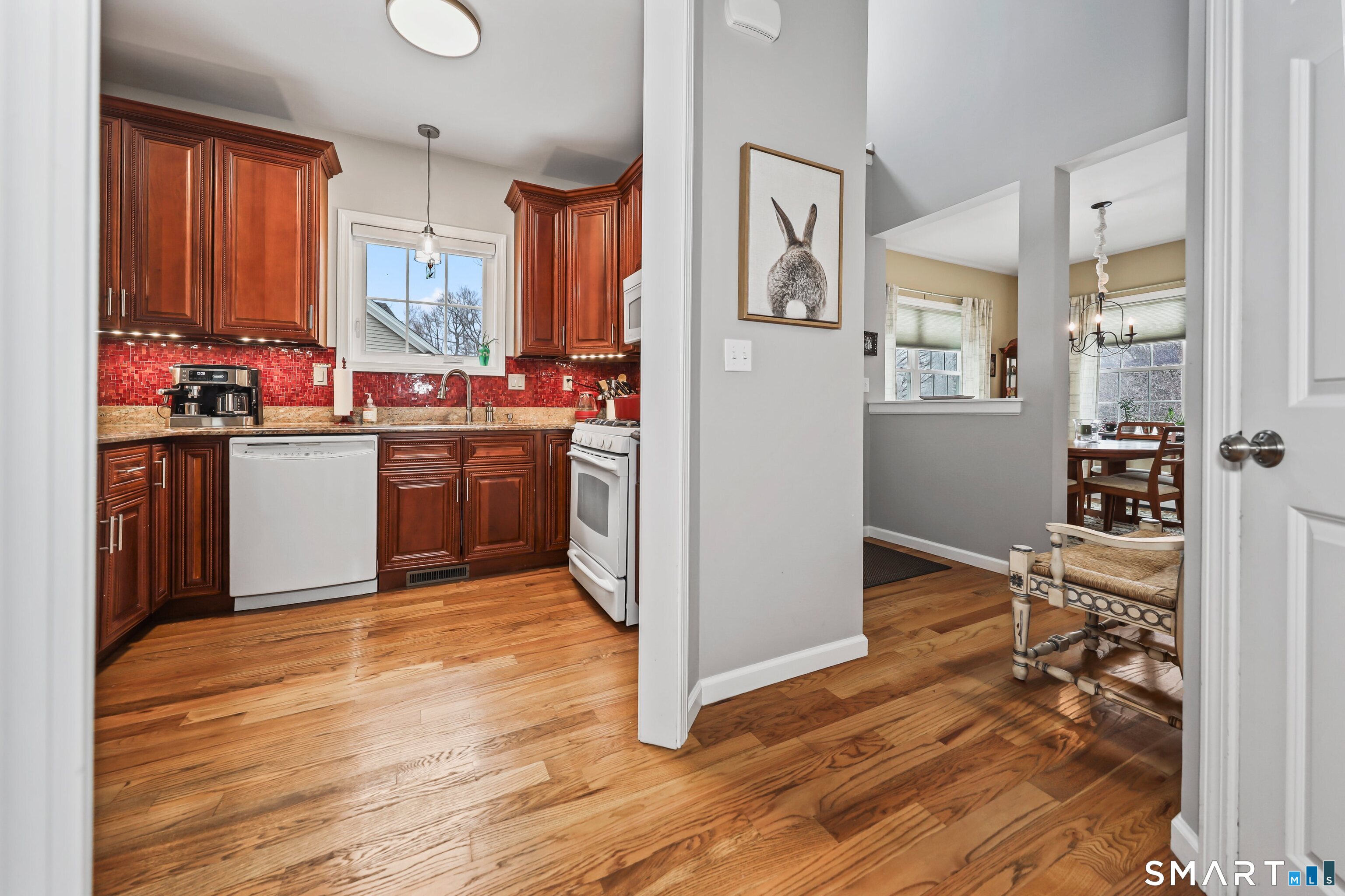 101 Turtlebrook Lane, Unit 101 Bristol, CT 06010 - Photo 12 of 48 a kitchen with stainless steel appliances granite countertop a refrigerator stove and sink
