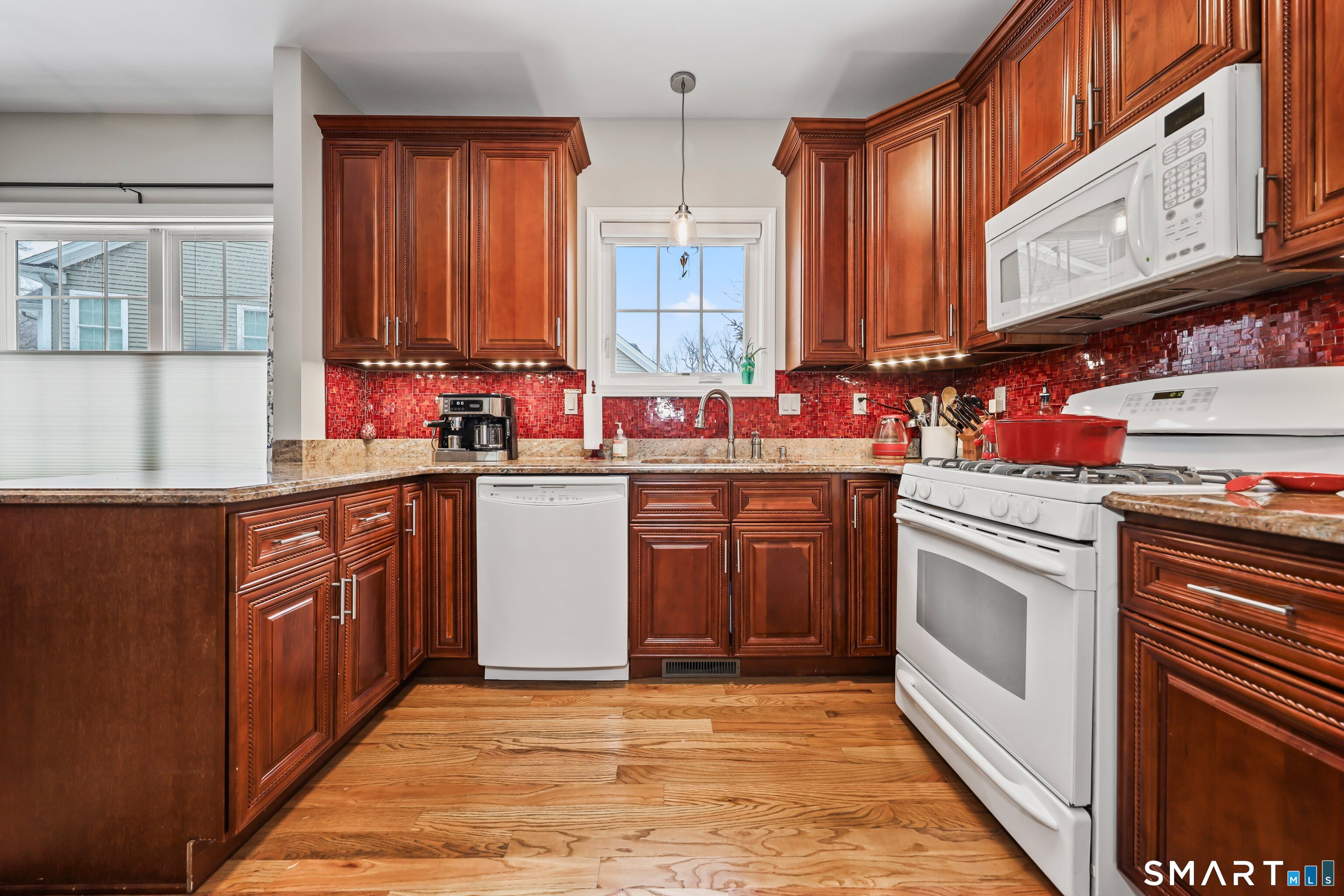 101 Turtlebrook Lane, Unit 101 Bristol, CT 06010 - Photo 13 of 48 a kitchen with stainless steel appliances a sink stove and cabinets