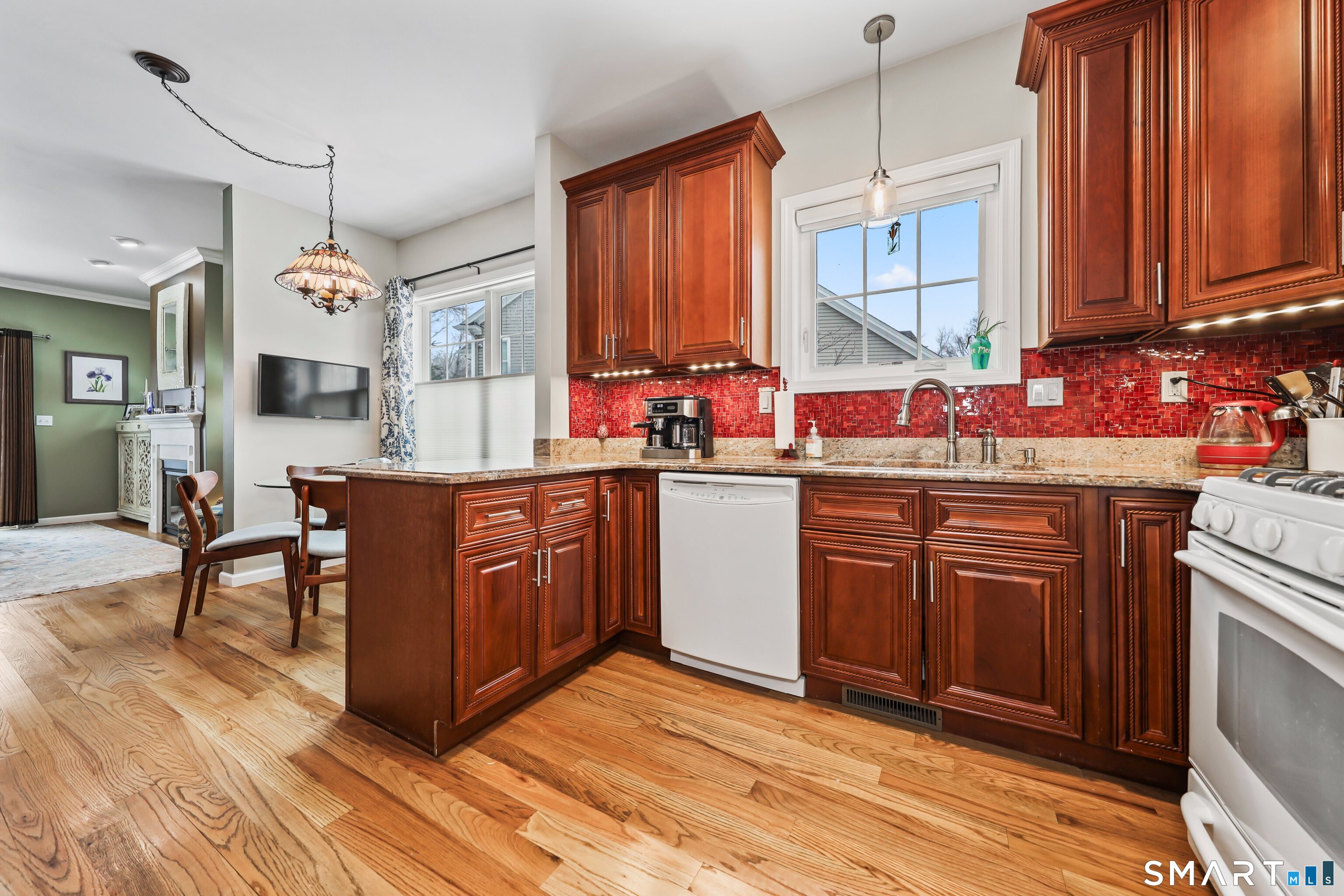 101 Turtlebrook Lane, Unit 101 Bristol, CT 06010 - Photo 16 of 48 a kitchen with a sink stove and cabinets