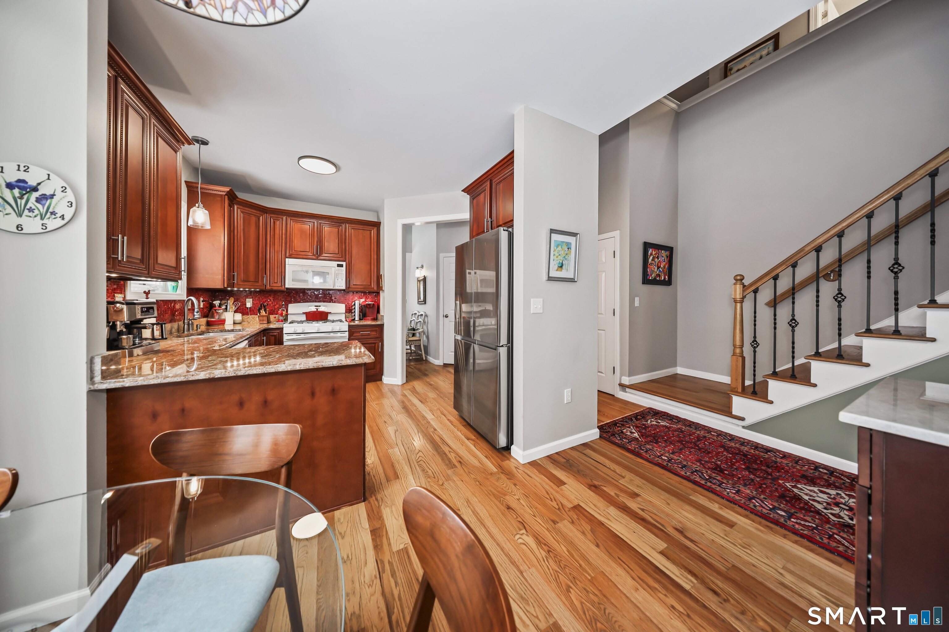 101 Turtlebrook Lane, Unit 101 Bristol, CT 06010 - Photo 21 of 48 a dining room with furniture and a floor to ceiling window