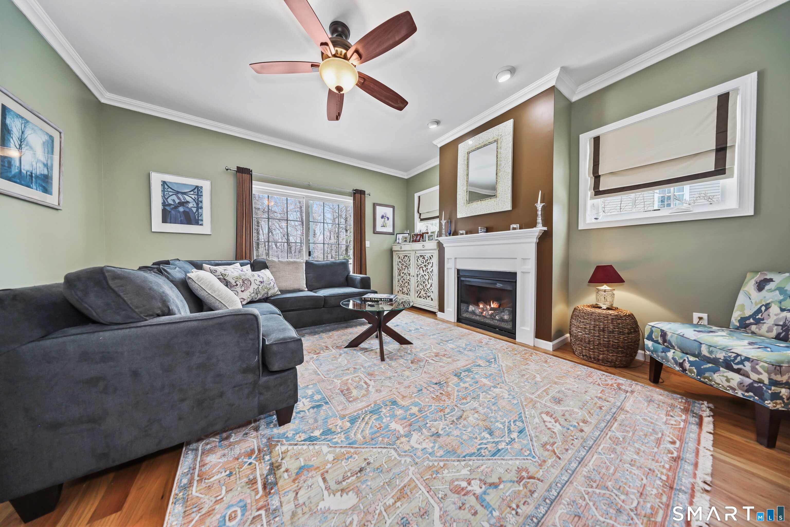 101 Turtlebrook Lane, Unit 101 Bristol, CT 06010 - Photo 23 of 48 a living room with furniture a window and a fireplace