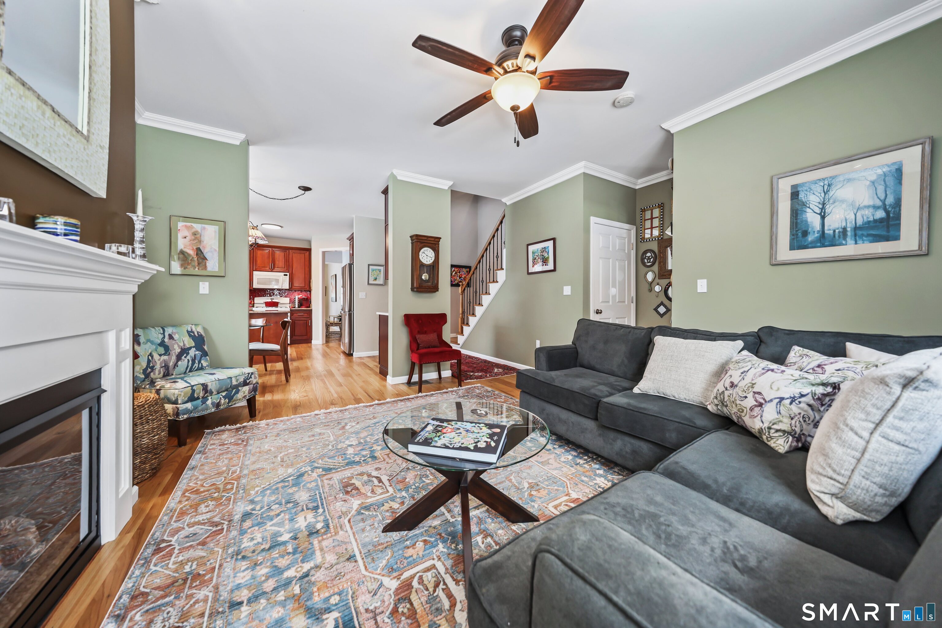 101 Turtlebrook Lane, Unit 101 Bristol, CT 06010 - Photo 24 of 48 a living room with furniture and a fireplace