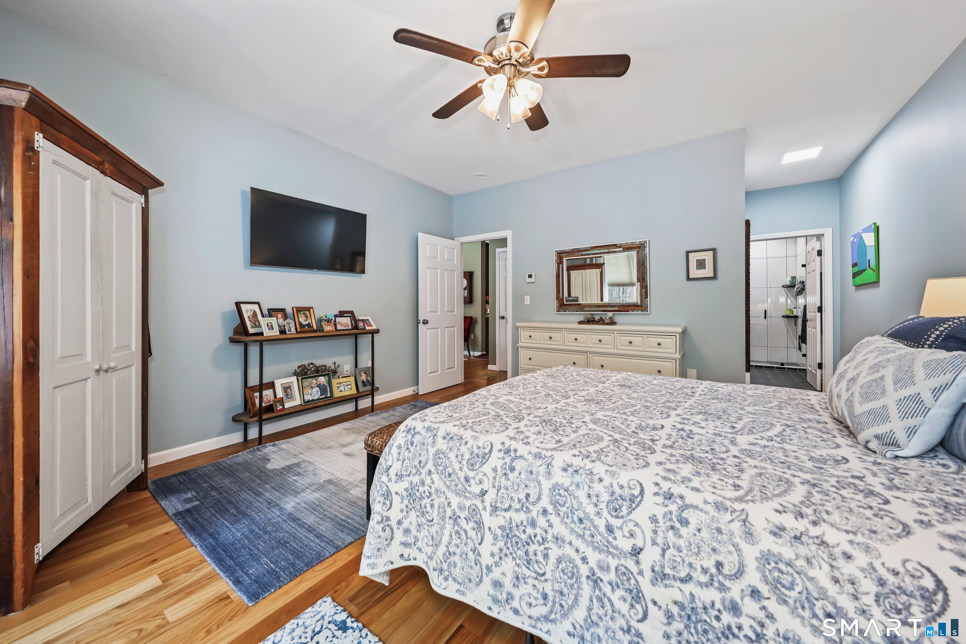 101 Turtlebrook Lane, Unit 101 Bristol, CT 06010 - Photo 27 of 48 a living room with furniture and a flat screen tv
