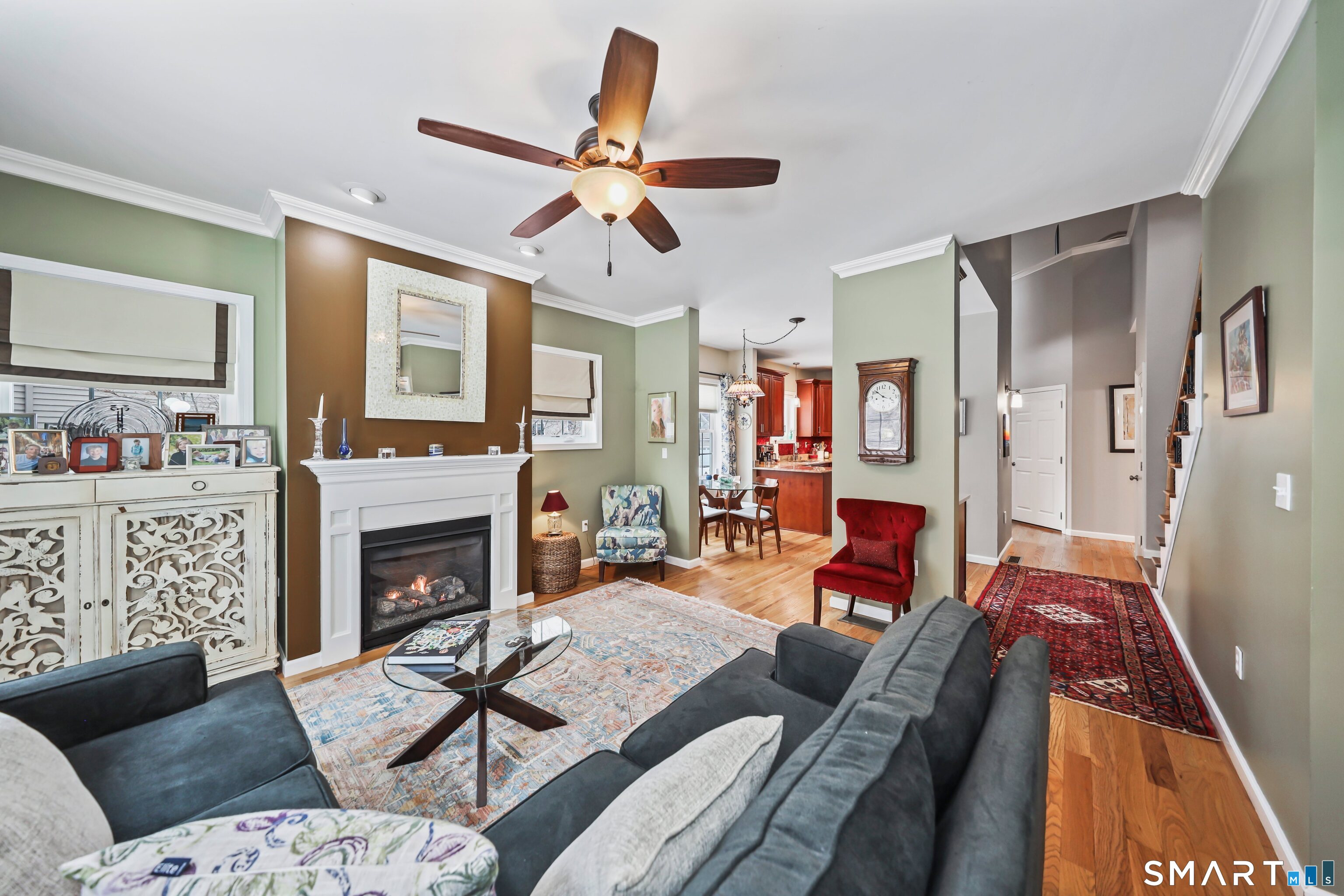 101 Turtlebrook Lane, Unit 101 Bristol, CT 06010 - Photo 3 of 48 a living room with furniture fireplace and flat screen tv