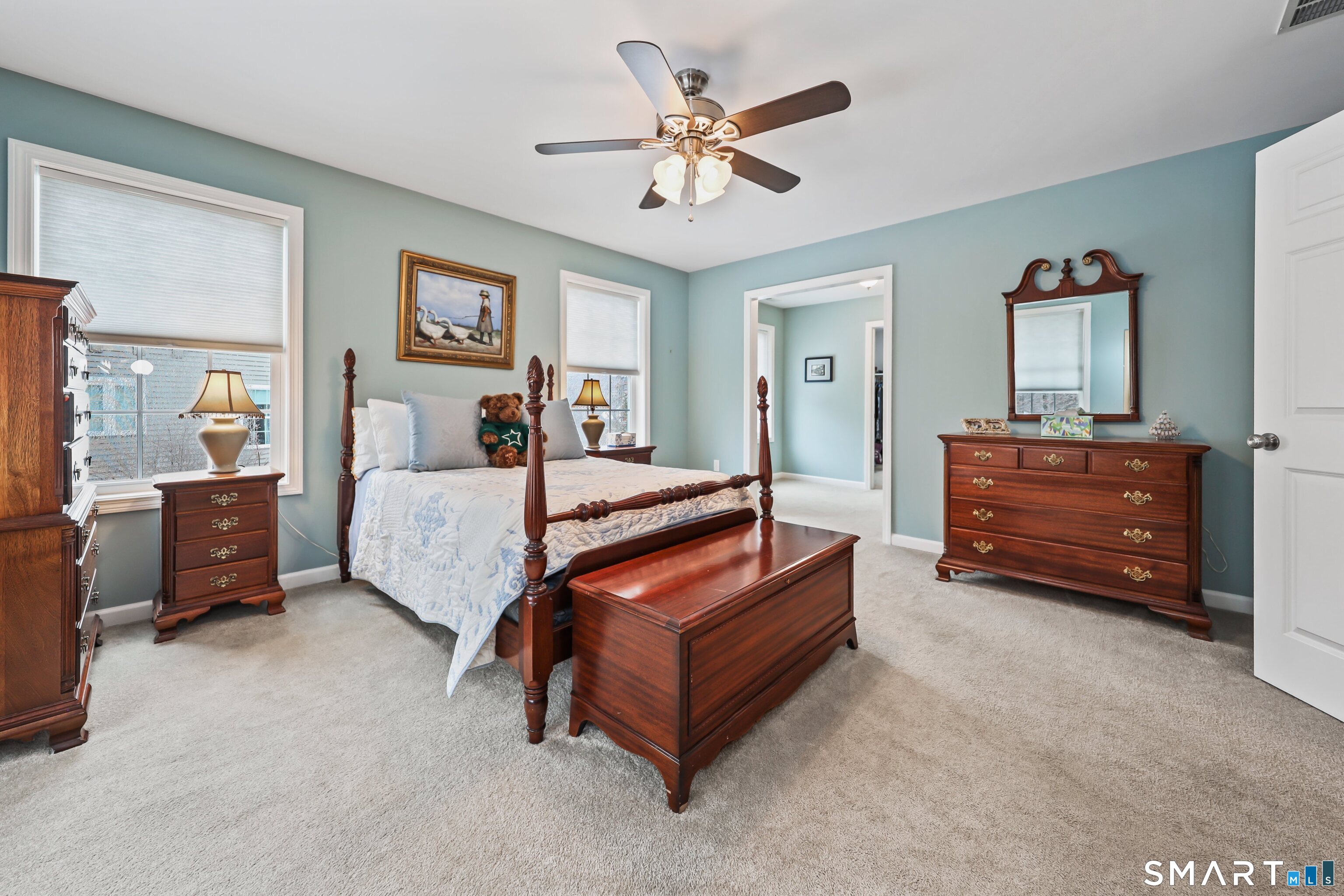 101 Turtlebrook Lane, Unit 101 Bristol, CT 06010 - Photo 31 of 48 a spacious bedroom with a bed and a chandelier