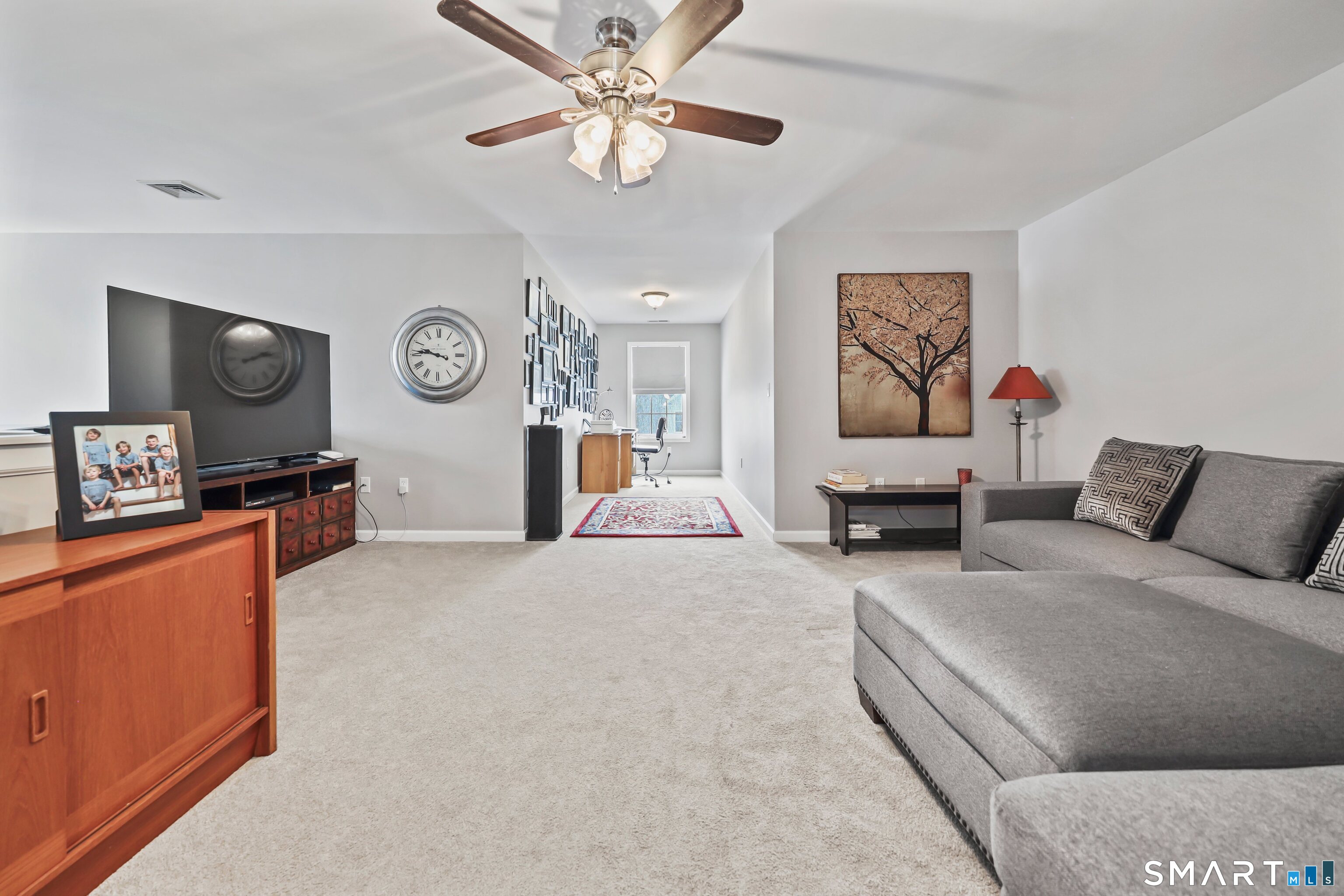 101 Turtlebrook Lane, Unit 101 Bristol, CT 06010 - Photo 35 of 48 a living room with furniture and a large window