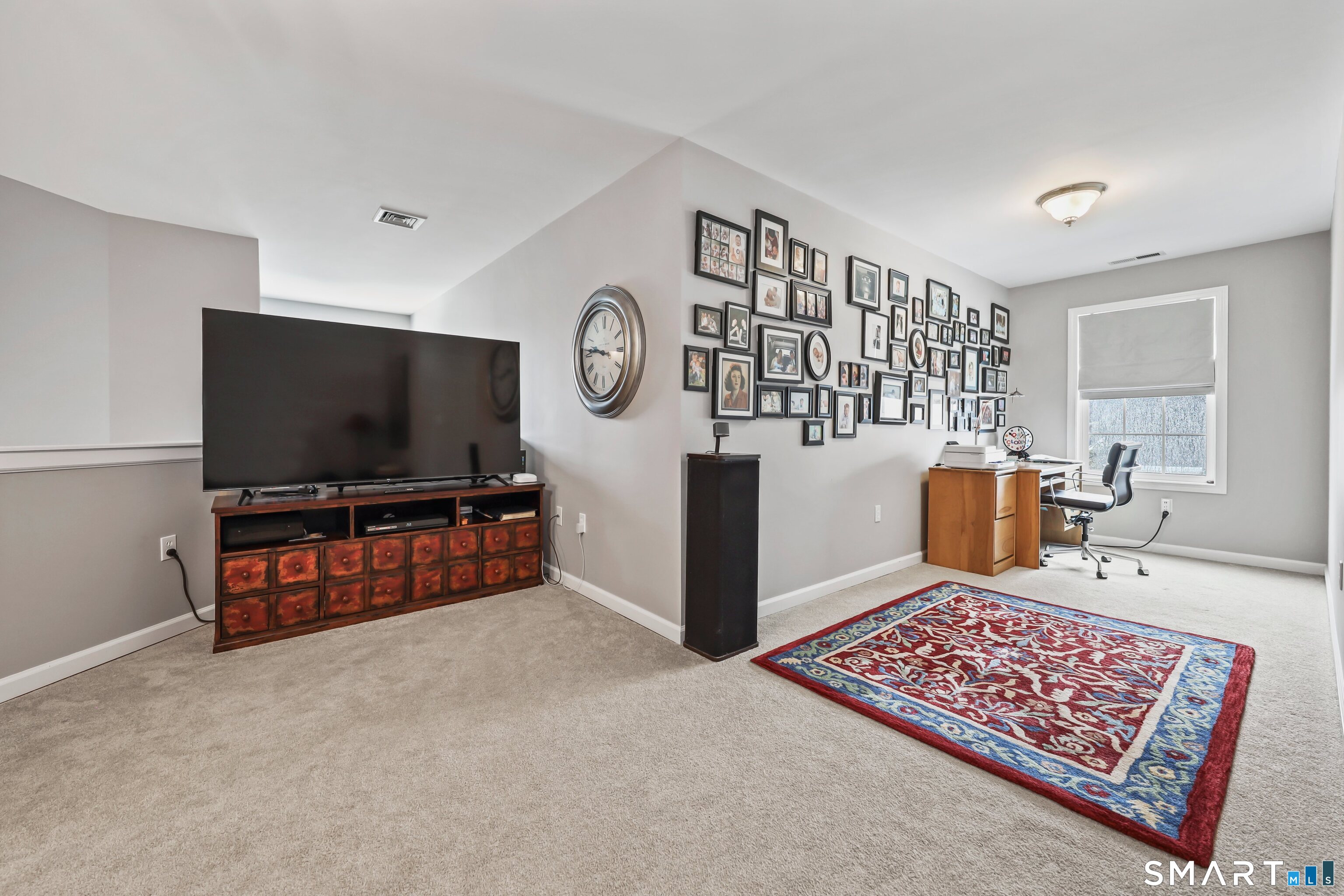 101 Turtlebrook Lane, Unit 101 Bristol, CT 06010 - Photo 40 of 48 a living room with furniture and a flat screen tv