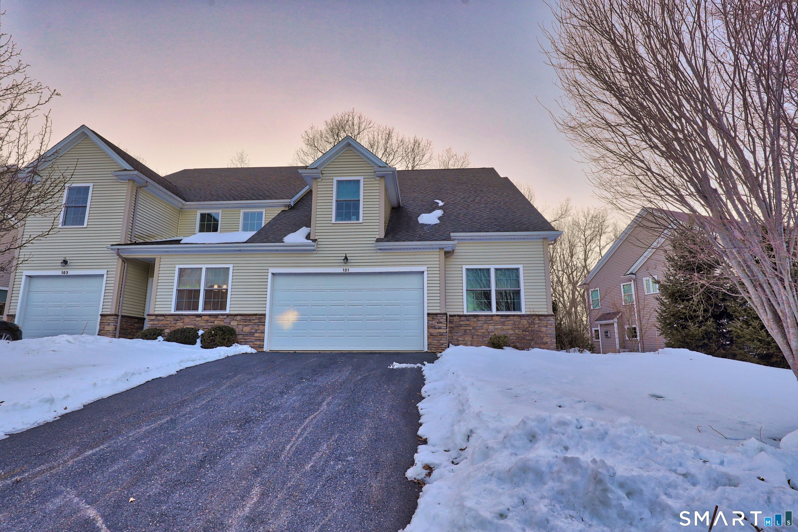 101 Turtlebrook Lane, Unit 101 Bristol, CT 06010 - Photo 4 of 48 a front view of a house with a yard