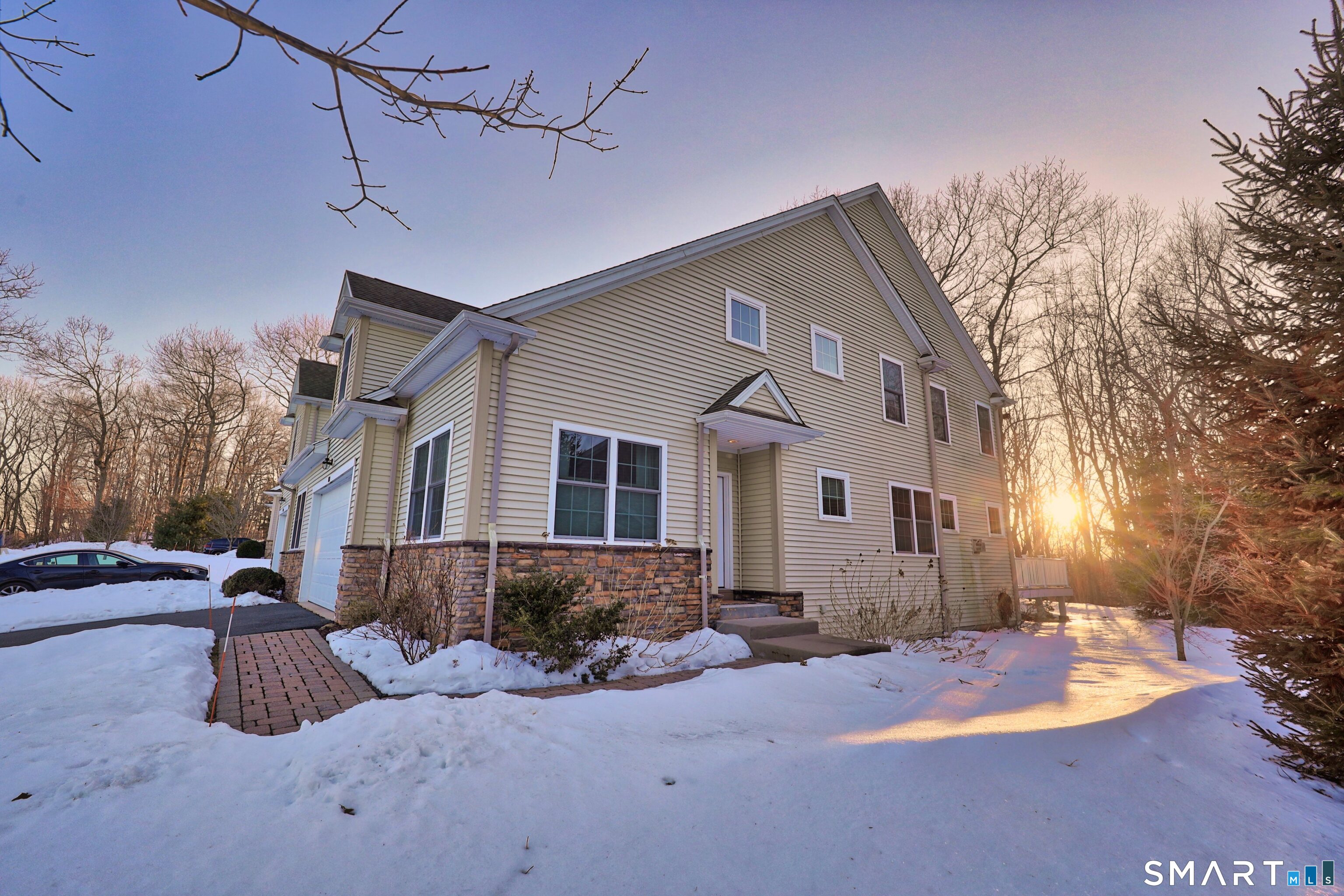 101 Turtlebrook Lane, Unit 101 Bristol, CT 06010 - Photo 46 of 48 a view of a house with a snow in the yard