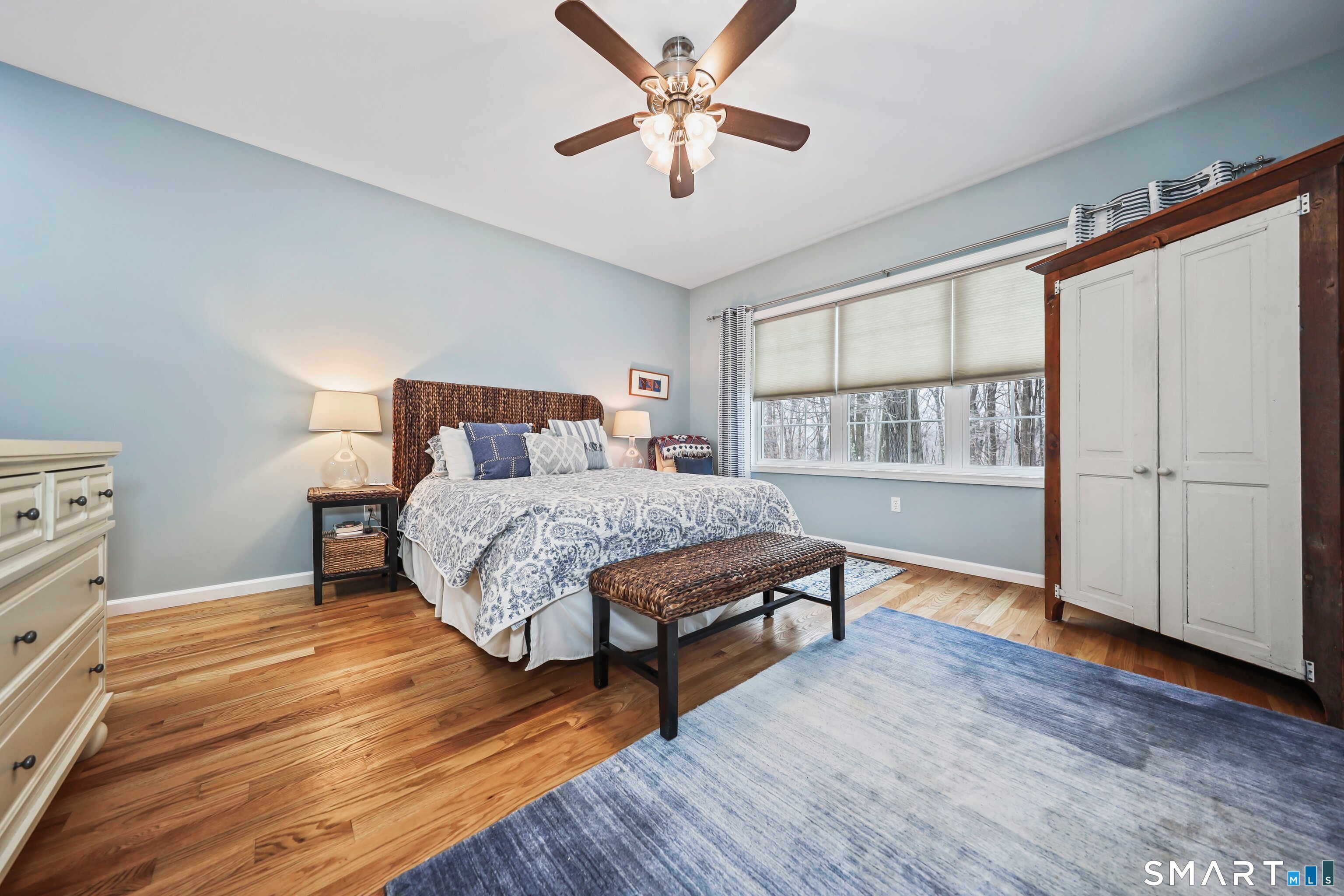 101 Turtlebrook Lane, Unit 101 Bristol, CT 06010 - Photo 6 of 48 a bedroom with a large bed and a chandelier fan