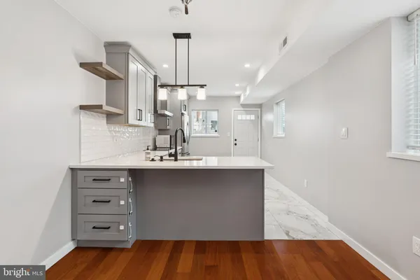 a bathroom with a sink double vanity and a mirror