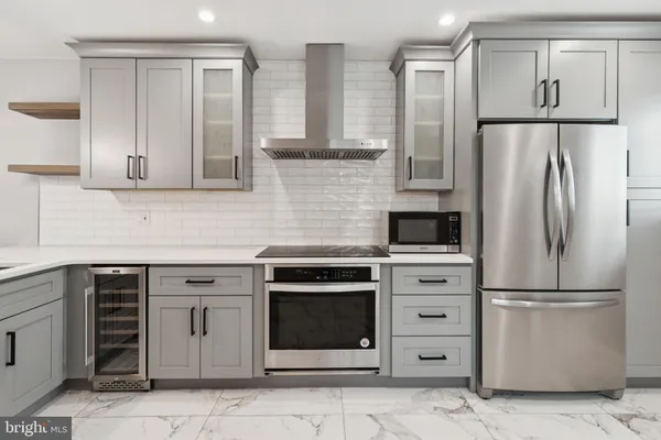 a kitchen with appliances cabinets and a counter top space