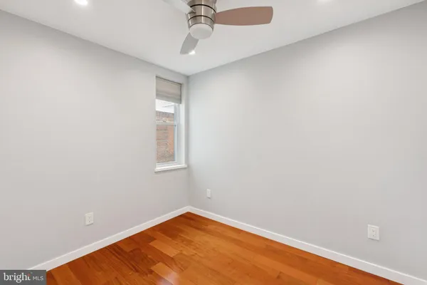 a view of hallway with wooden floor