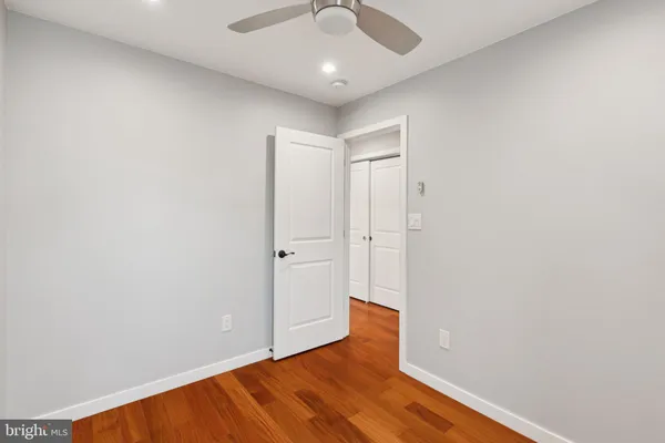 a bathroom with a sink a toilet and shower curtain