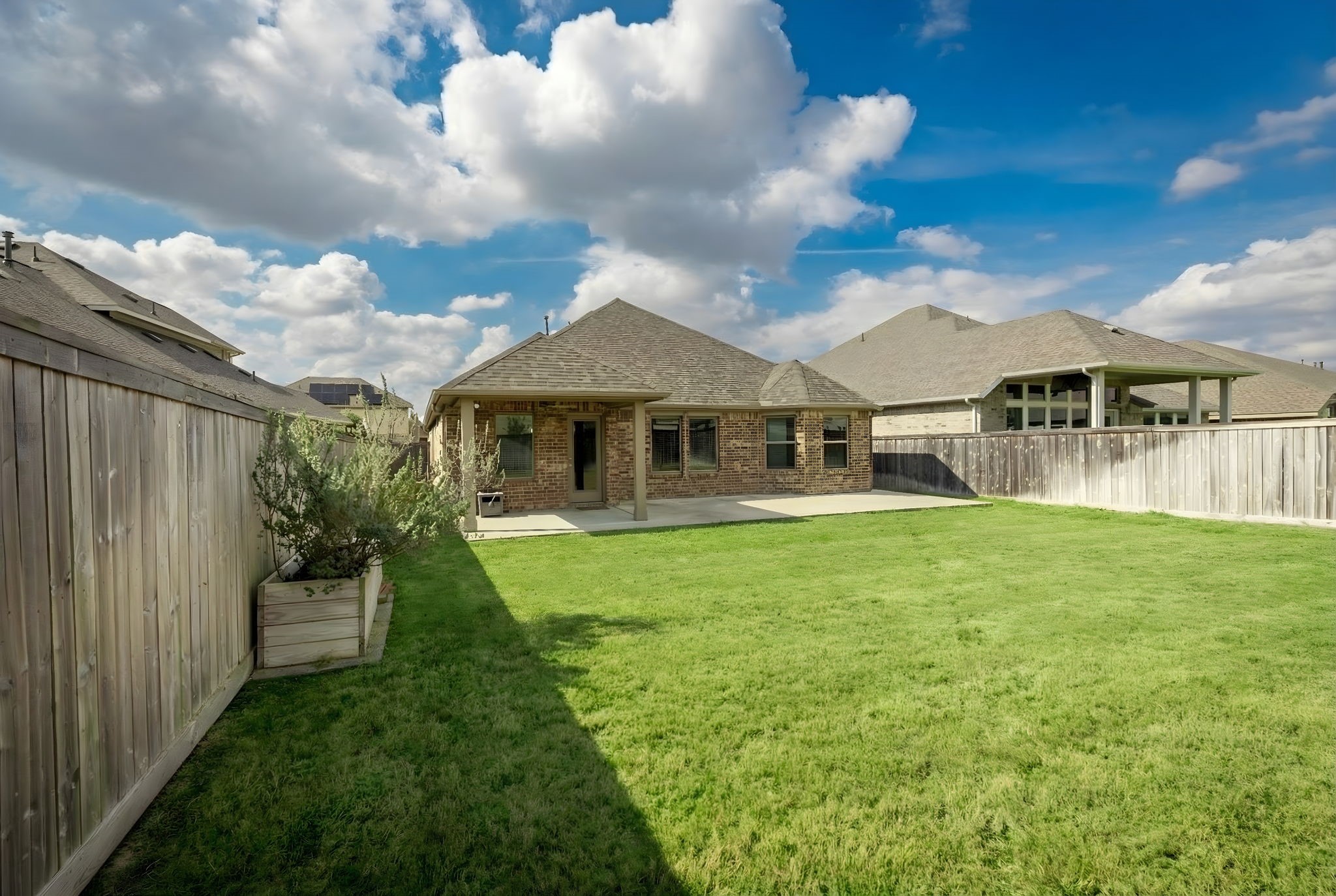 14914 Big Bend Ranch Drive Cypress, TX 77433 - Photo 44 of 49 a front view of a house with a garden
