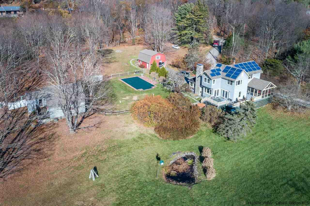 11 Sherman Road Woodstock, NY 12498 - Photo 1 of 19 a backyard of a house with table and chairs